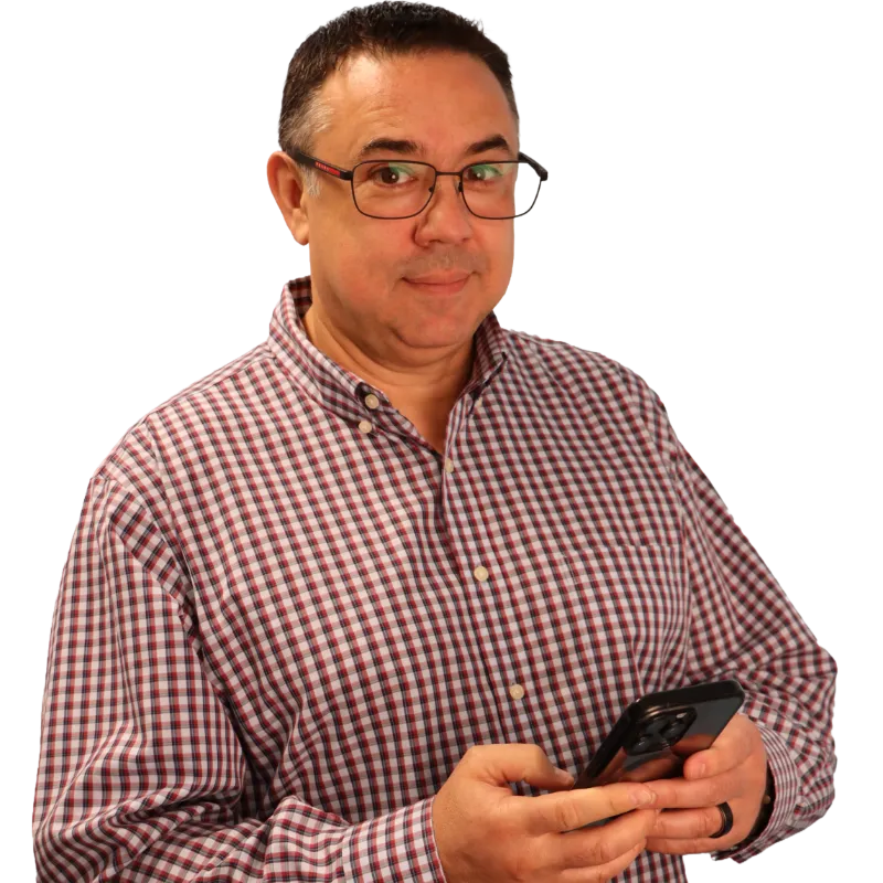 Alex Payne wearing checked shirt standing on phone